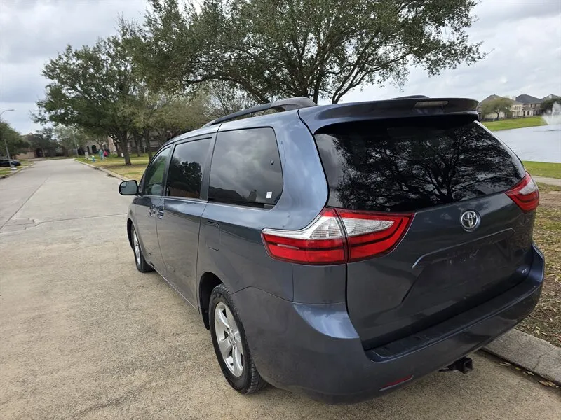 Back view of a Used 2015 Toyota Sienna LE 8 Passenger for sale in Spring TX
