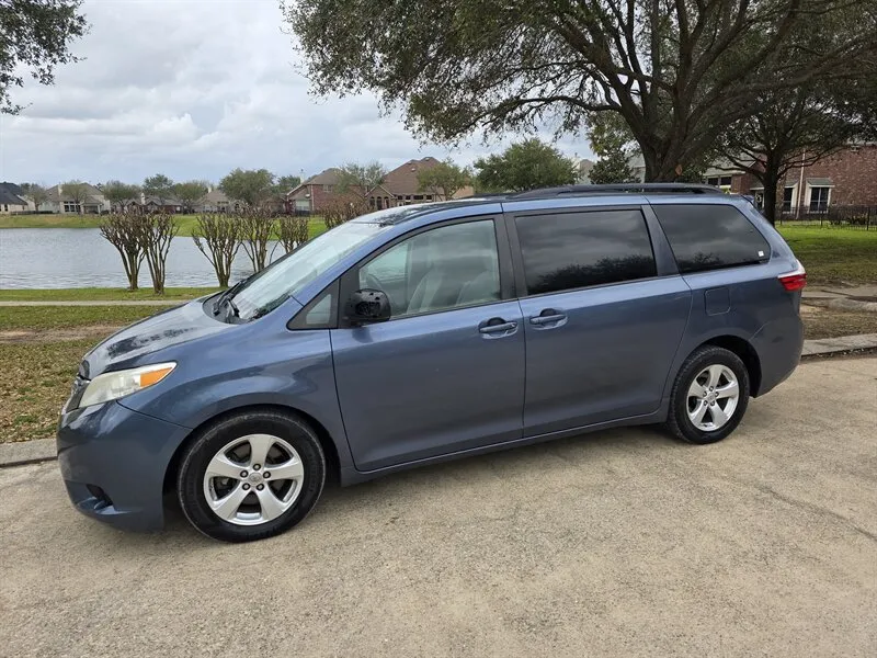 Left side view of a Used 2015 Toyota Sienna LE 8 Passenger for sale in Spring TX