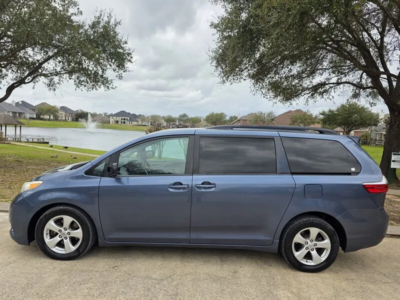Side view of a Used 2015 Toyota Sienna LE 8 Passenger for sale in Spring TX