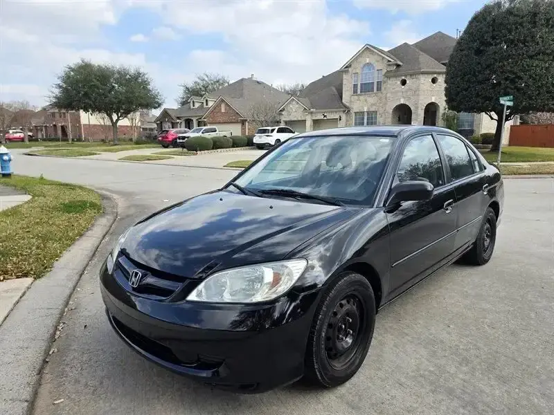 Black Honda Civic, front three-quarter view