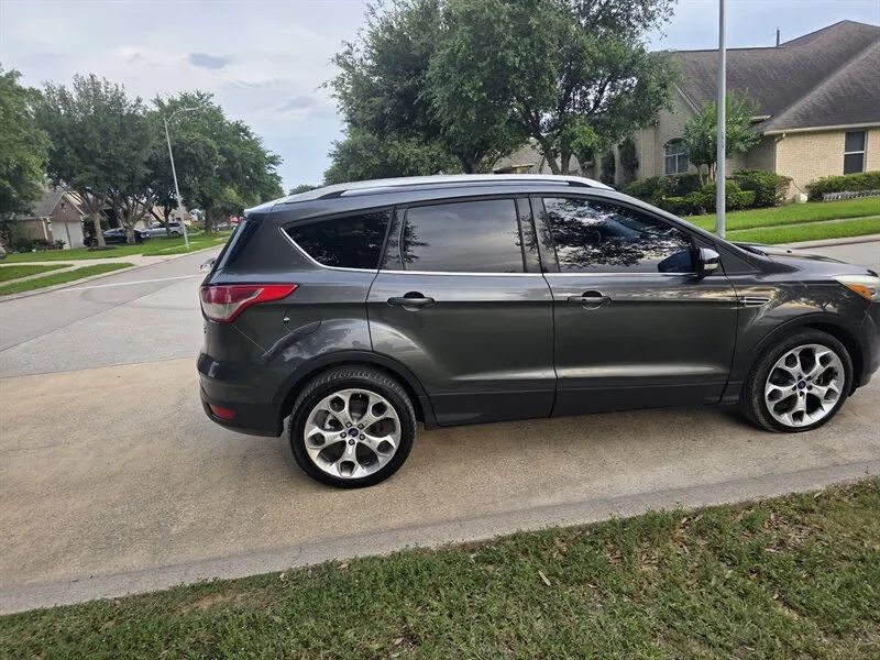 Gray 2015 Ford Escape Titanium side profile near Houston TX
