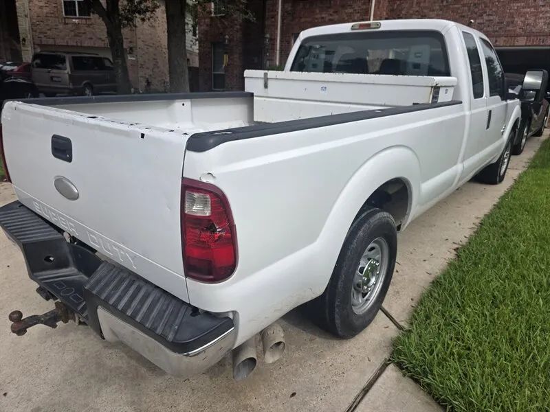 Ford F-250 Super Duty rear side used pickup photo near Houston TX