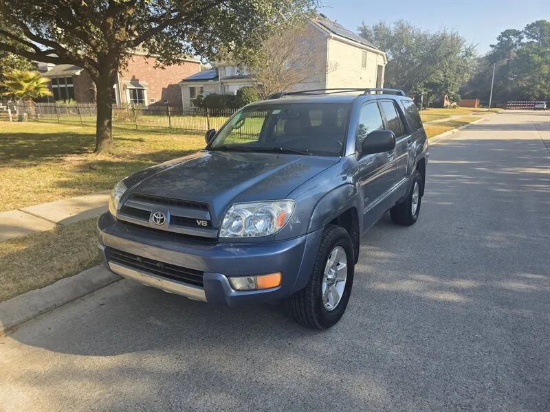 Blue 2004 Toyota 4Runner SR5 front angle near Houston TX