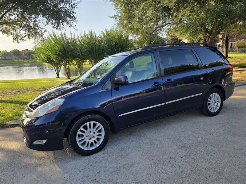 Blue 2007 Toyota Sienna XLE Limited side profile near Houston TX