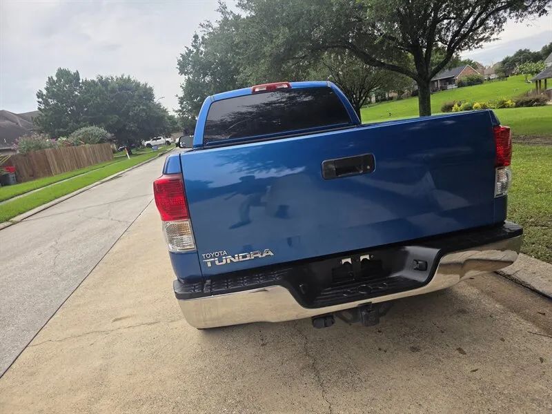 Rear view of a blue Toyota Tundra Double Cab pickup bed near Houston TX