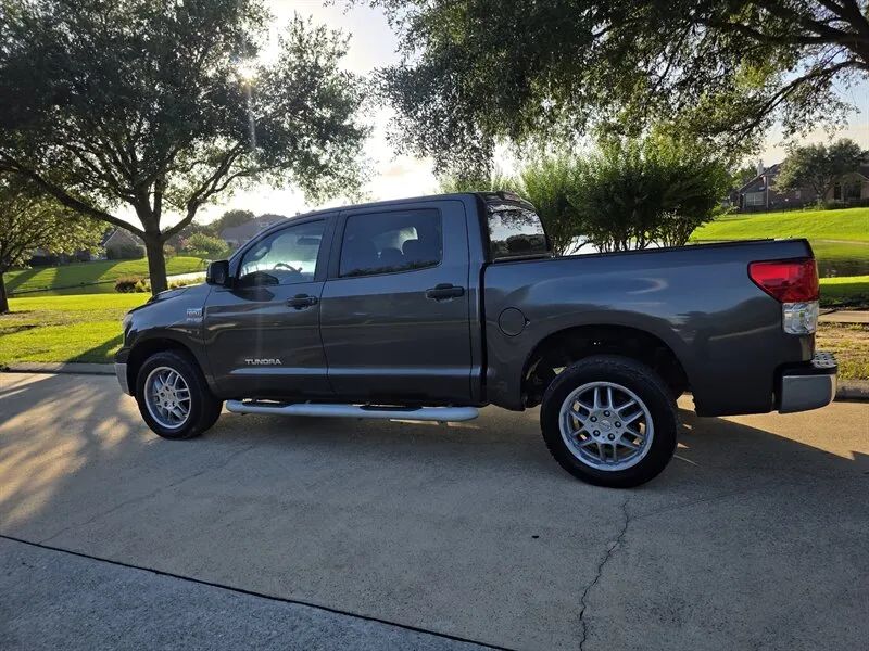 Gray Toyota Tundra CrewMax used pickup side profile near Houston TX